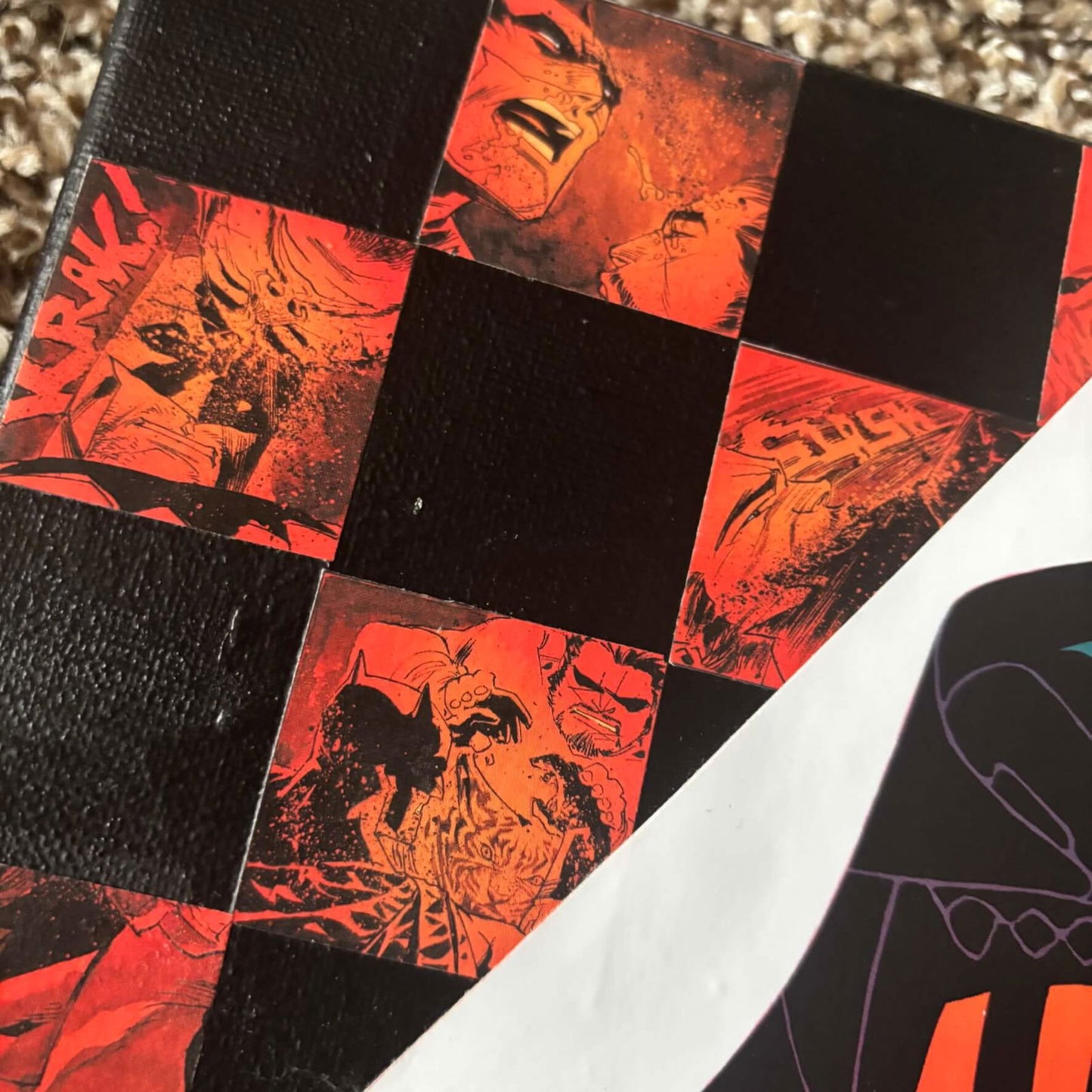 Checkered Batman | Comic Collage | 8x10 | ORIGINAL - Checkered Batman | Comic Collage | 8x10 | ORIGINAL - Dorrin Gingerich Art - Close-up of a Batman comic book with a checkered design resting on the floor.
