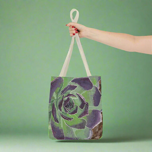 Succulent Tote Bag - Succulent Tote Bag - Dorrin Gingerich Art - A hand holds a stylish green and purple succulent tote bag, showcasing its vibrant colors and unique design.