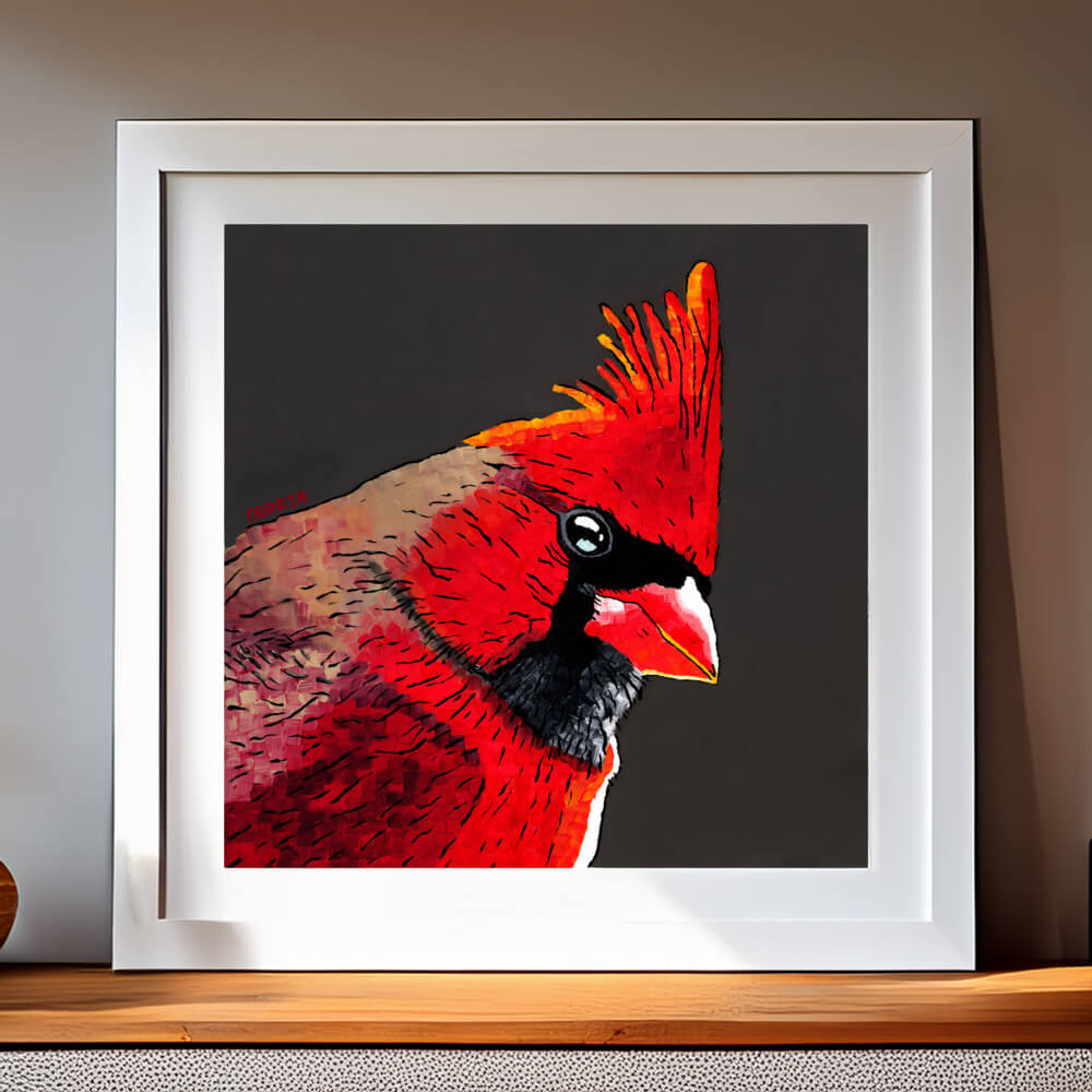 A striking red cardinal bird displayed in a white frame, showcasing its bright feathers – elegant presentation of prints of cardinals for modern decor