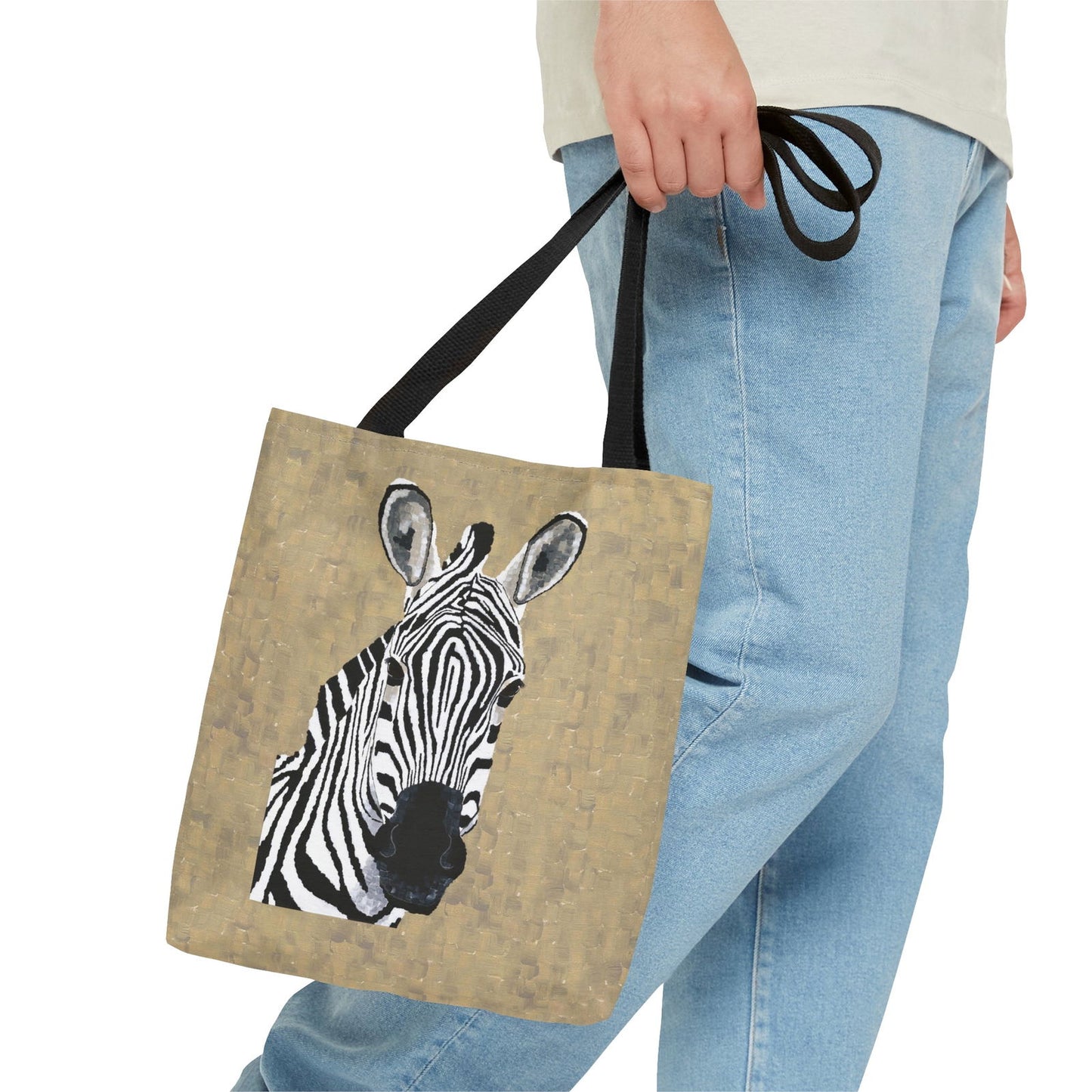 Male model holding Zebra 1 tote bag on display — showcases bold animal wall art style with original zebra print artwork by Dorrin Gingerich.