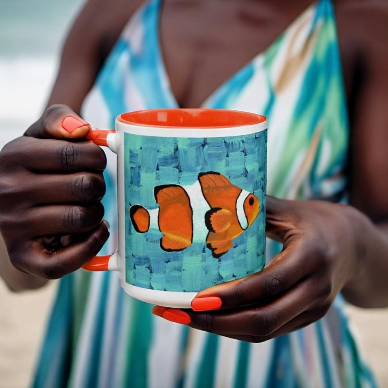 Woman holding a clown fish mug on the beach, savoring the serene seaside.