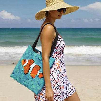 Woman holding a cute clownfish tote bag, adding a splash of color to her outfit.