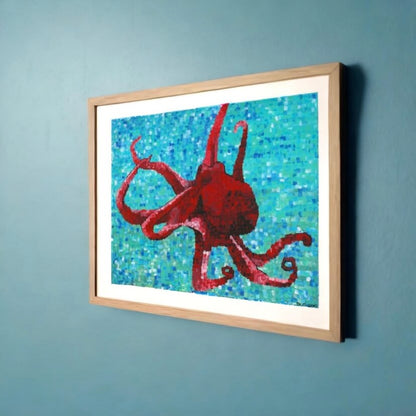 A mesmerizing mosaic wall, painted by Dorrin Gingerich, captures the beauty of an octopus with blue and red paint.