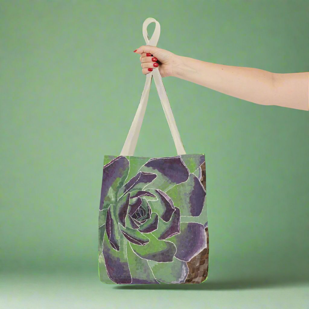 Succulent Tote Bag - Succulent Tote Bag - Dorrin Gingerich Art - A hand holds a stylish green and purple succulent tote bag, showcasing its vibrant colors and unique design.
