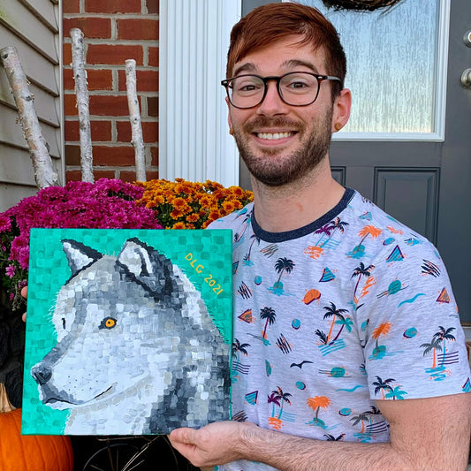 Wolf-Dorrin-Selfie_Artist Dorrin Gingerich holding his original artwork wolf paper print, a high-quality art print on paper for collectors.