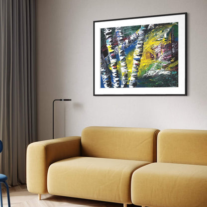 Framed Active Forest 1 abstract print above a mustard yellow sofa in a living room