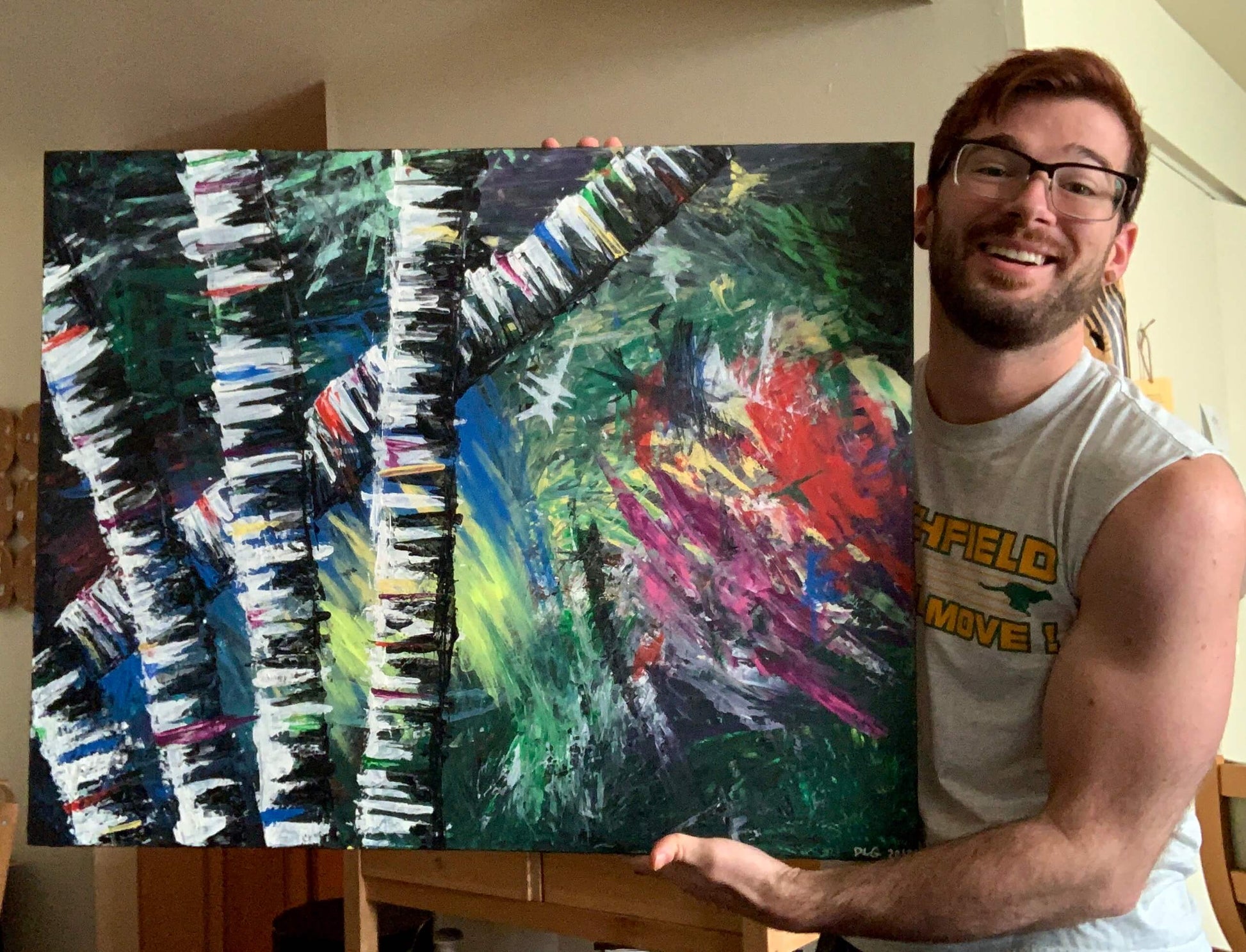 Dorrin Gingerich holding the original Active Forest 2 abstract birch forest painting