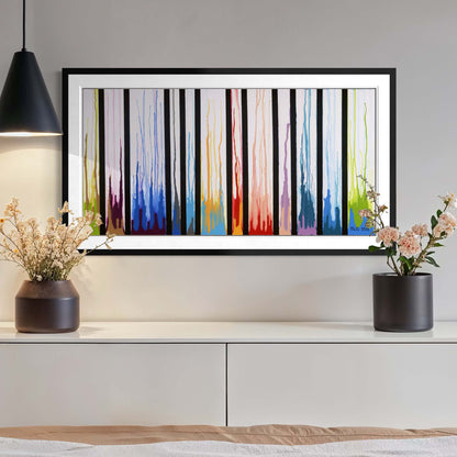 Framed Colors Rising print above a console with a pendant lamp and dried flowers