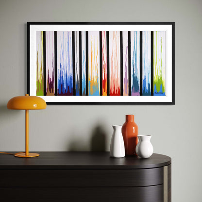 Framed Colors Rising print on a gray wall with a mustard lamp and ceramic vases