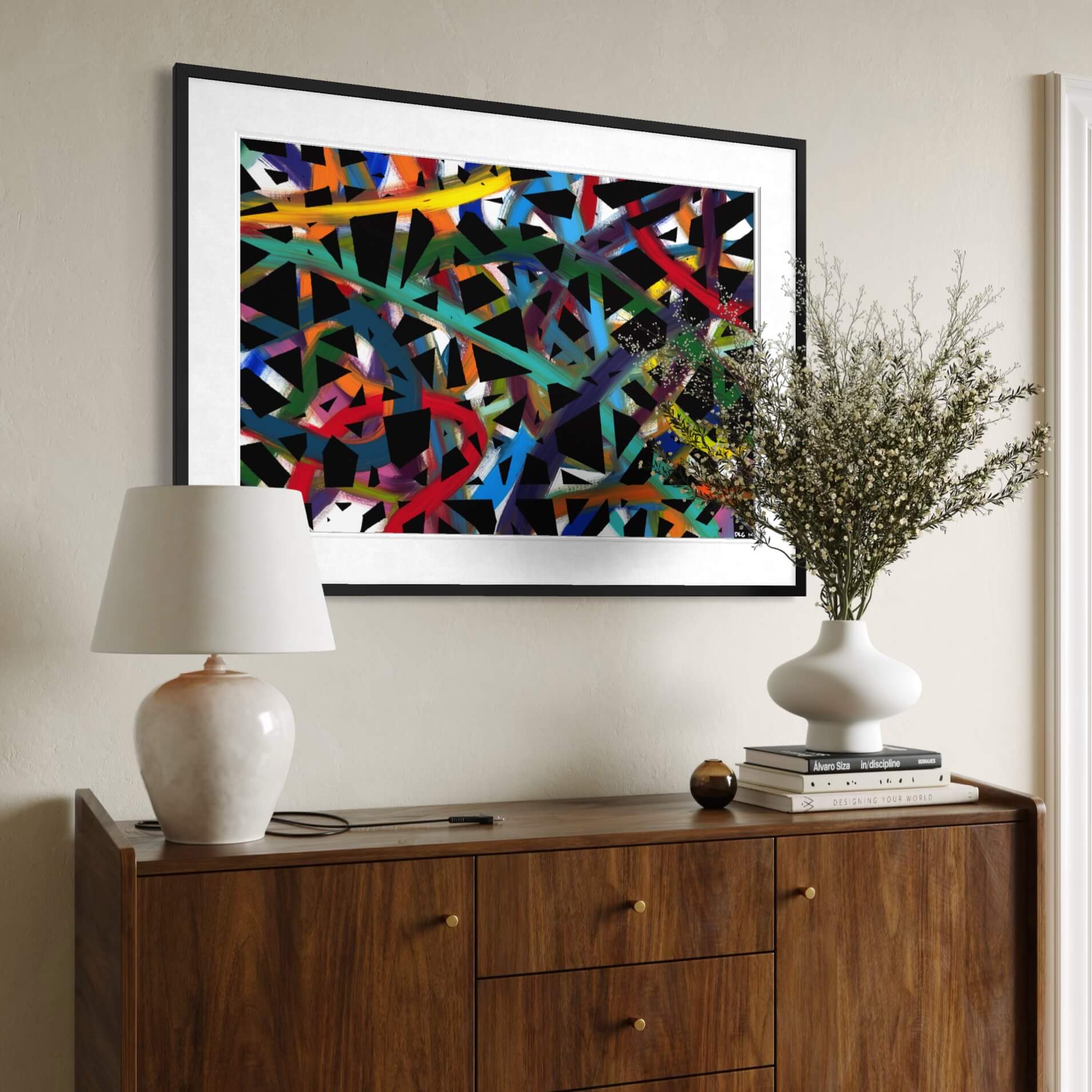 Framed Cross Roads print above a wood dresser styled with a lamp and plant