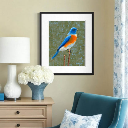 Framed eastern bluebird print on wall in blue and cream sitting room, nature bird art decor