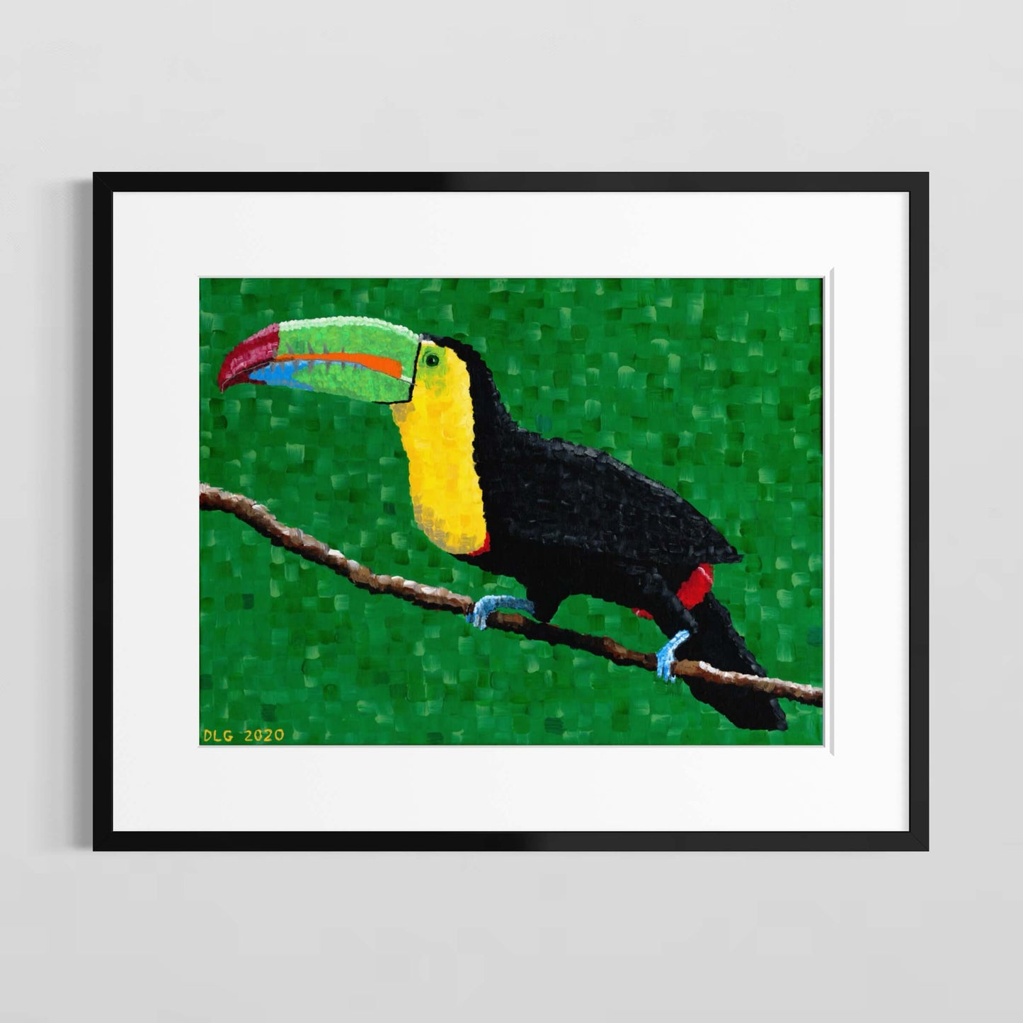 Framed toucan print with white matting displayed on a gray wall