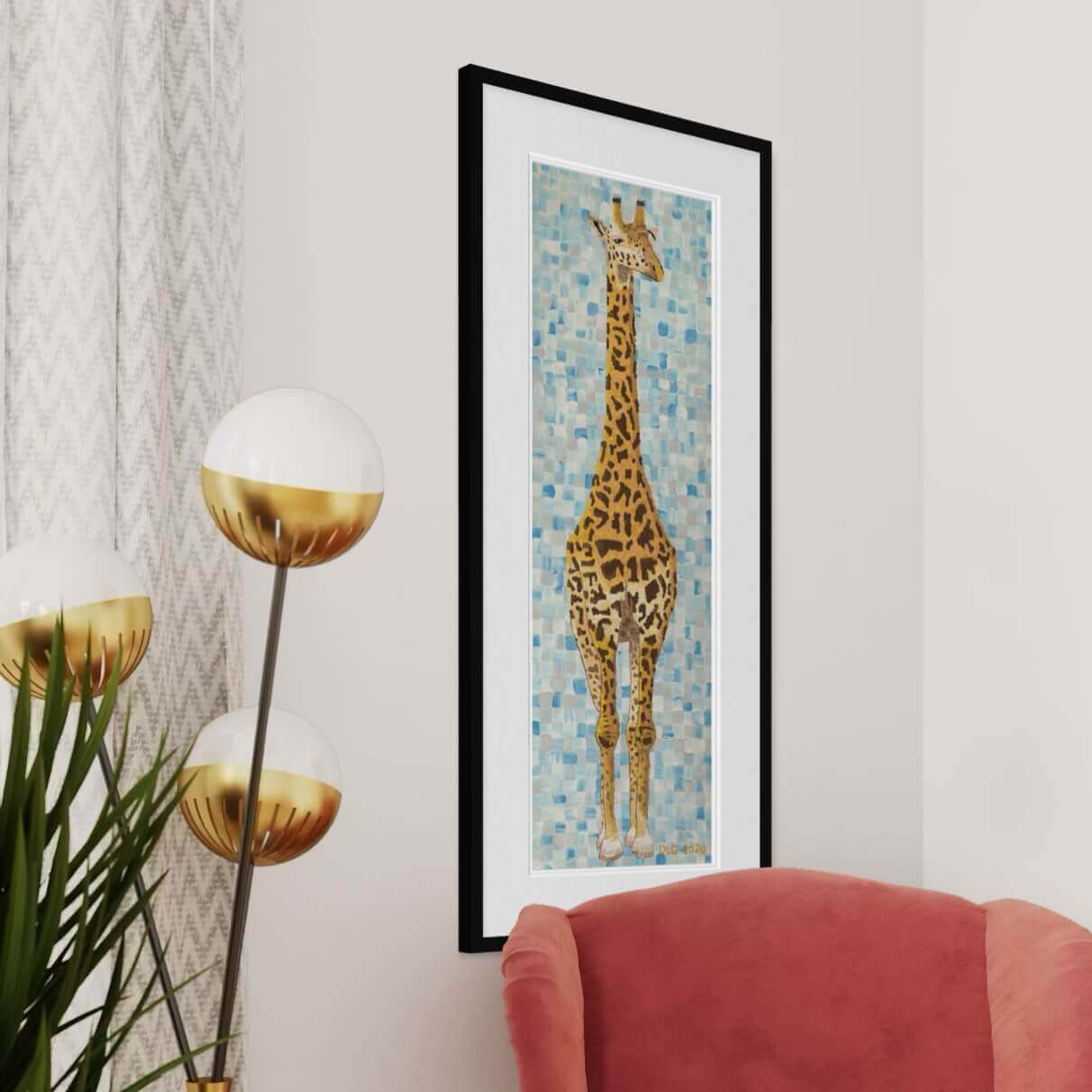 Framed giraffe art print on wall in modern living room with pink armchair and gold floor lamp