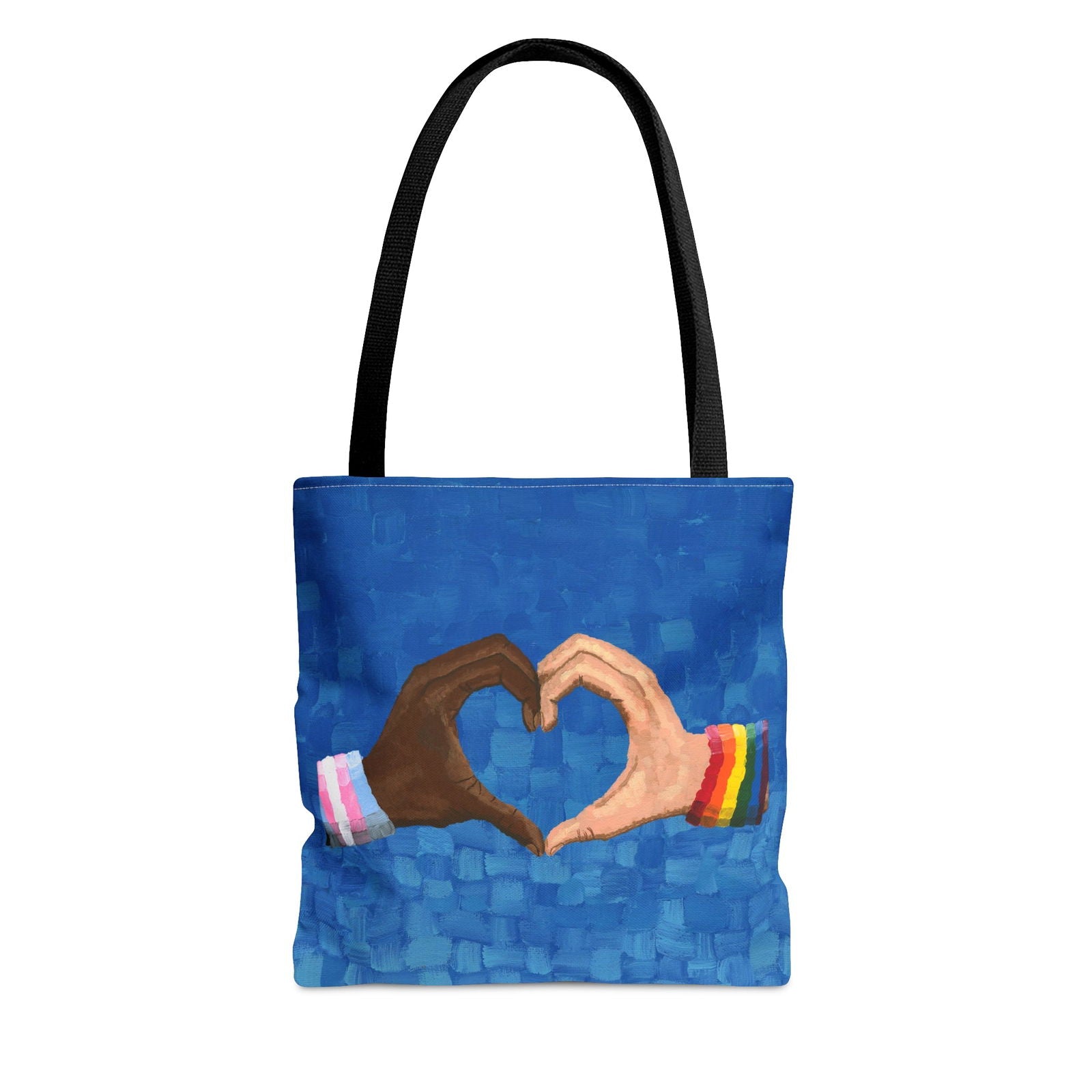 Loving Pride tote bag on a chair beside books — inspired by a pride canvas print, perfect for showcasing LGBT artwork and personal pride.