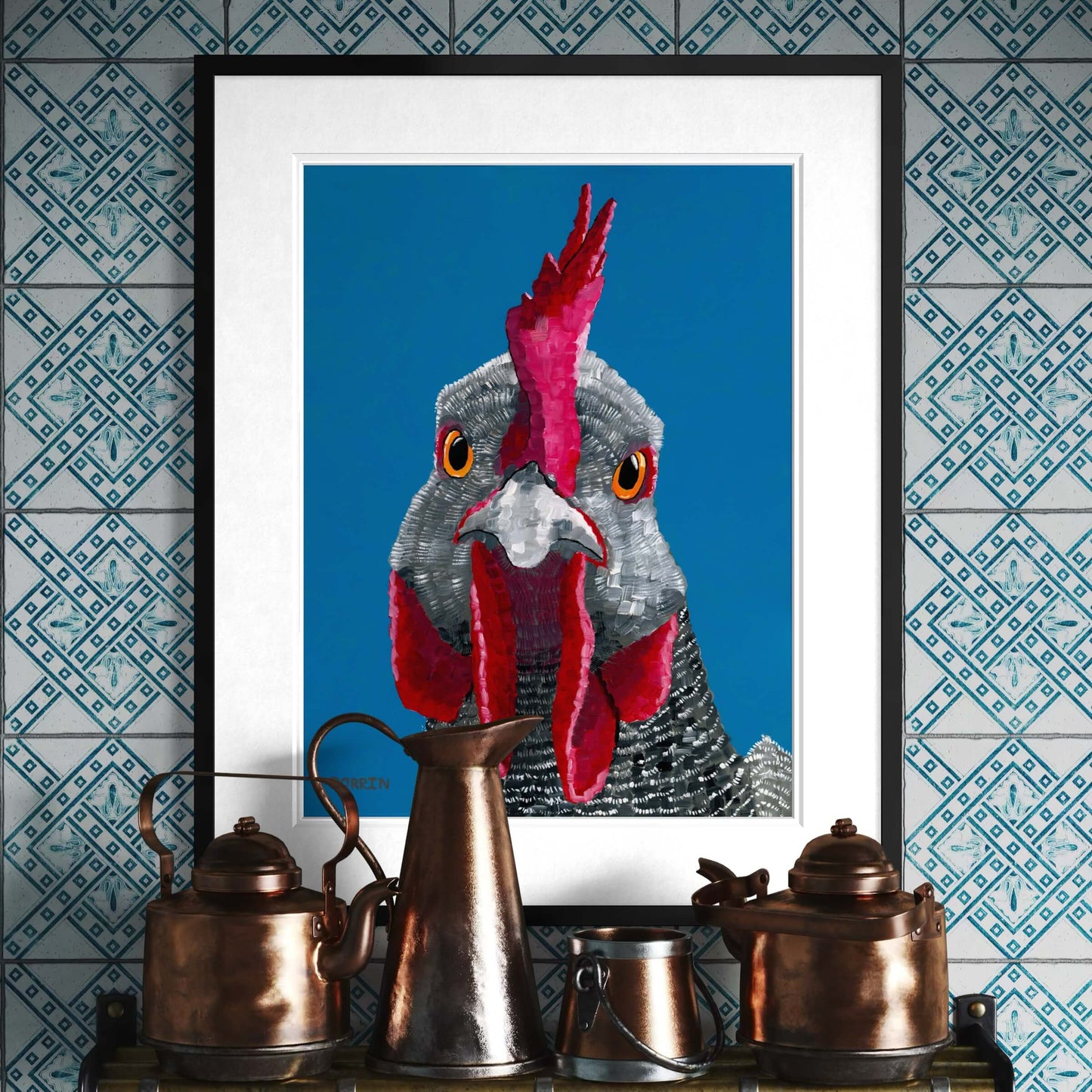 Framed rooster fine art print by Dorrin Gingerich displayed above copper kettles on patterned tile wall