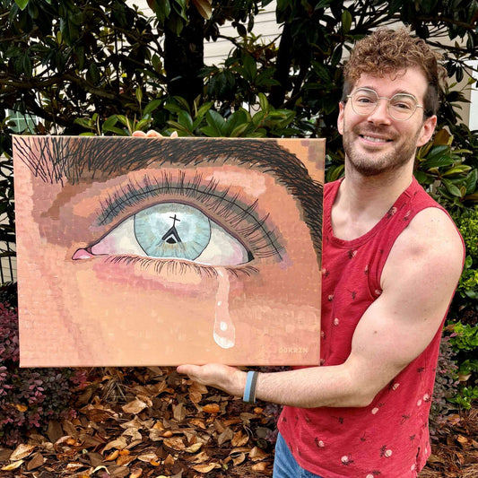 Dorrin Gingerich holding The Faith I Once Knew original painting outdoors