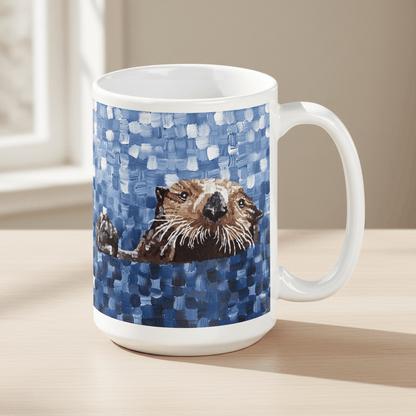 White mug with a sea otter design on a blue patterned background, placed on a light surface.