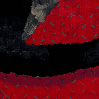 Close-up of the speckled red rug pattern beneath the cats